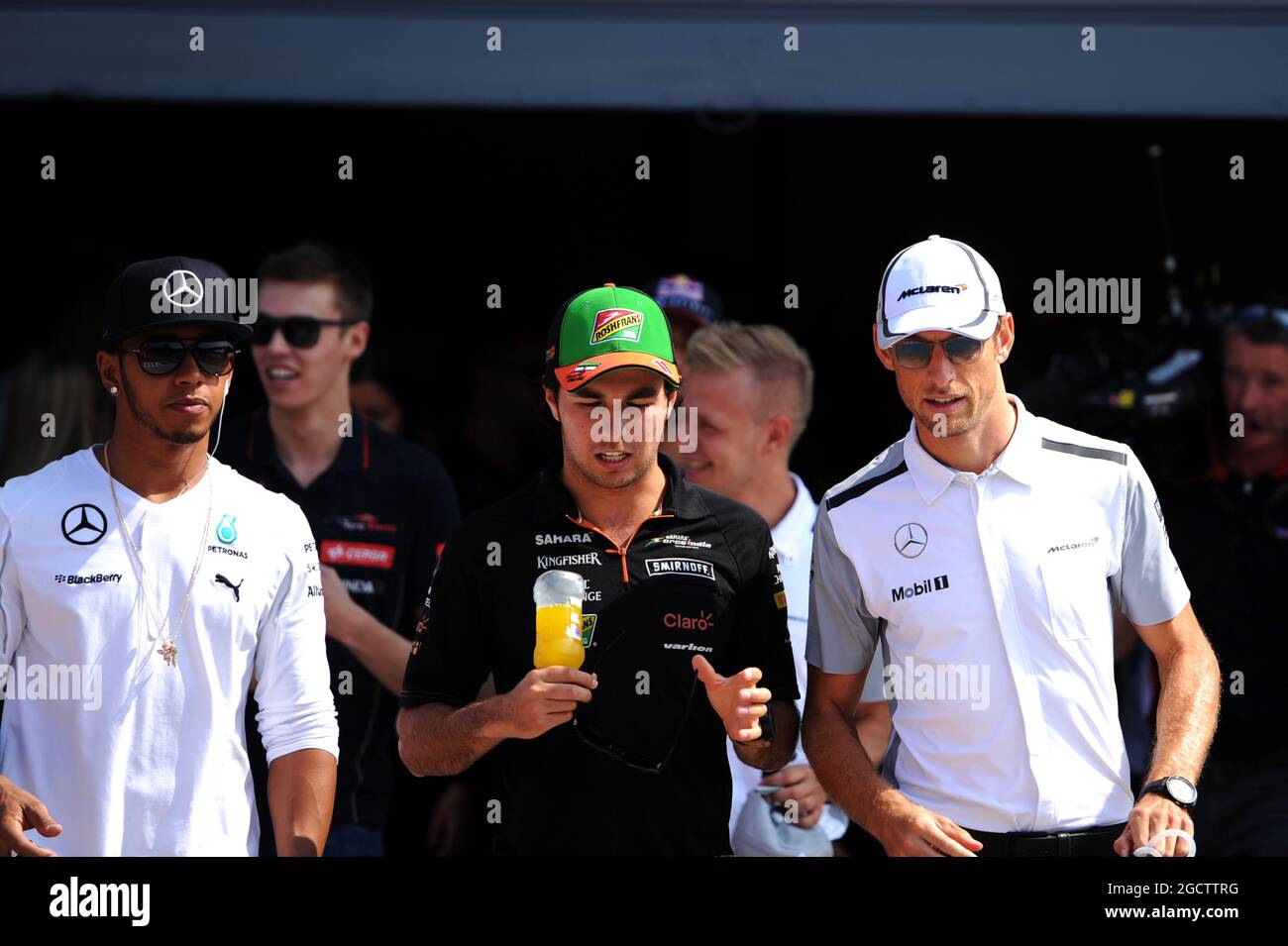 (L to R): Lewis Hamilton (GBR) Mercedes AMG F1 with Sergio Perez (MEX) Sahara Force India F1 and Jenson Button (GBR) McLaren on the drivers parade. Italian Grand Prix, Sunday 7th September 2014. Monza Italy. Stock Photo
