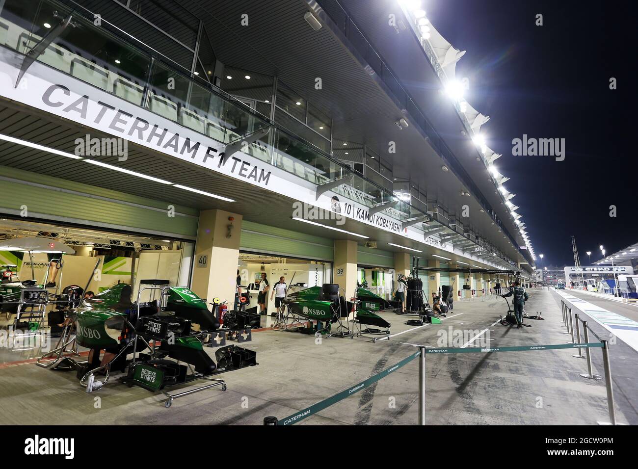 The Caterham F1 Team prepare for the GP in the pits. Abu Dhabi Grand Prix, Thursday 20th November 2014. Yas Marina Circuit, Abu Dhabi, UAE. Stock Photo