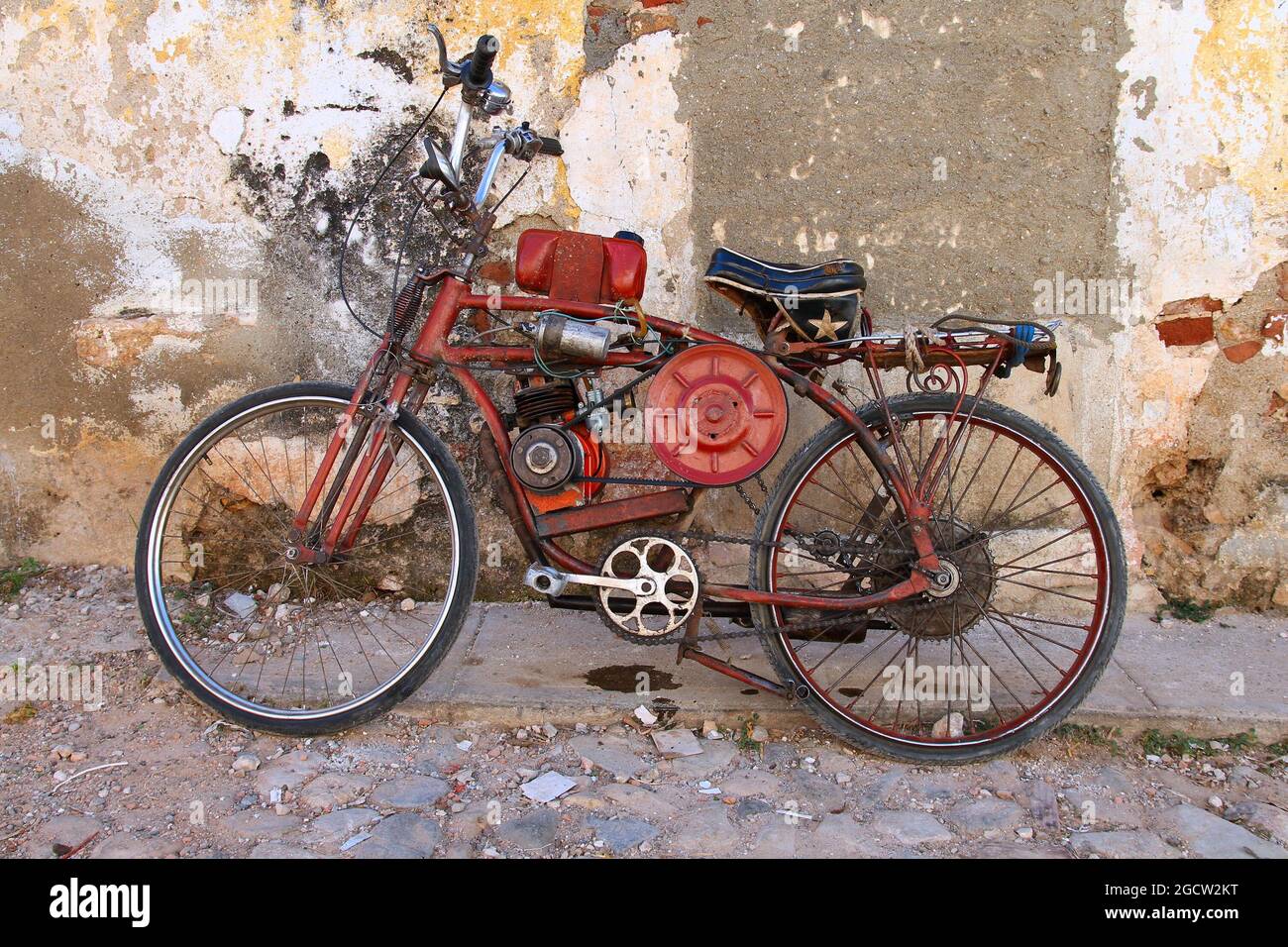 Custom modified bicycle. Home made motorbike made from bicycle and a small petrol engine. Effects of poverty in Cuba. Stock Photo