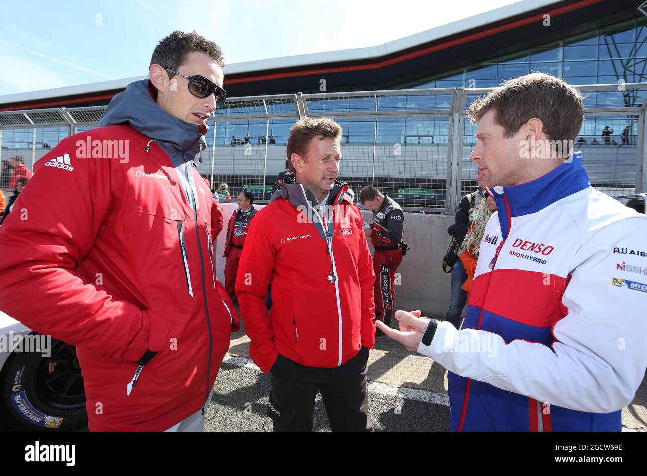 L to R): Oliver Jarvis (GBR) #08 Audi Sport Team Joest Audi R18 e-tron  quattro Hybrid on the grid with Allan McNish (GBR) and Anthony Davidson  (GBR) #01 Toyota Racing Toyota TS040