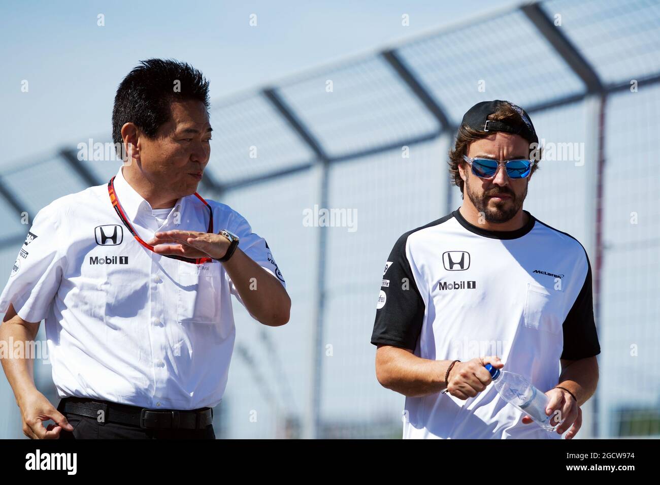(L to R): Yasuhisa Arai (JPN) Honda Motorsport Chief Officer walks the circuit with Fernando Alonso (ESP) McLaren. Canadian Grand Prix, Thursday 4th June 2015. Montreal, Canada. Stock Photo