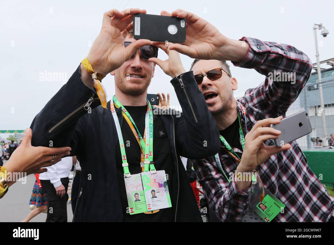 (L to R): Michael Fassbender (IRE) Actor with Bryan Singer (GBR) Film Director (Right) on the grid. Canadian Grand Prix, Sunday 7th June 2015. Montreal, Canada. Stock Photo