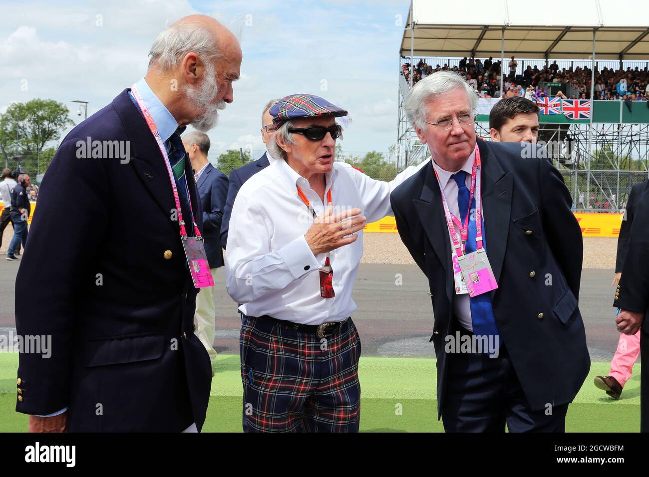 (L to R): HRH Prince Michael of Kent (GBR) with Jackie Stewart (GBR) and Michael Fallon MP (GBR) Defence Secretary on the grid. British Grand Prix, Sunday 5th July 2015. Silverstone, England. Stock Photo
