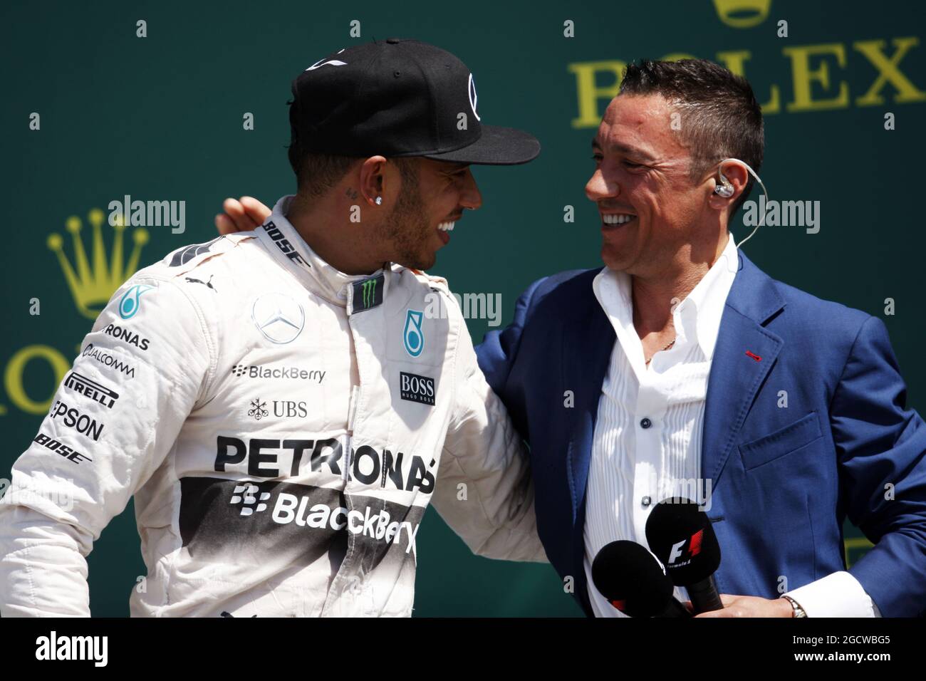 The podium (L to R): Race winner Lewis Hamilton (GBR) Mercedes AMG F1 with Frankie Dettori (GBR). British Grand Prix, Sunday 5th July 2015. Silverstone, England. Stock Photo
