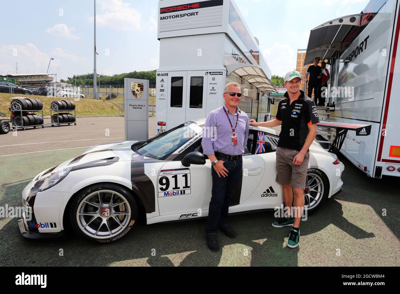 L to R): Johnny Herbert (GBR) Sky Sports F1 Presenter and his Porsche  Supercup car, with Nico Hulkenberg (GER) Sahara Force India F1. Hungarian  Grand Prix, Thursday 23rd July 2015. Budapest, Hungary