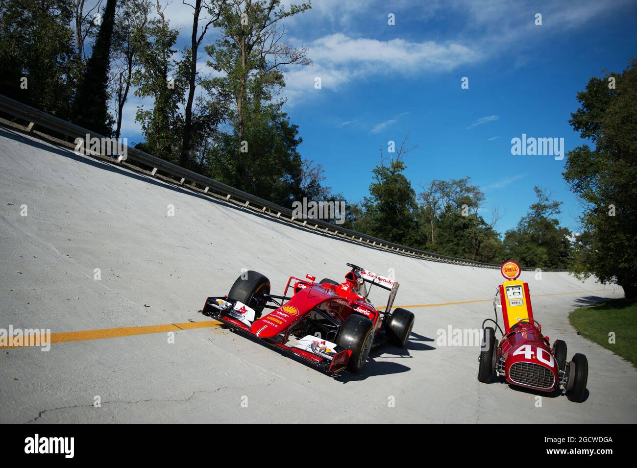 The Ferrari SF15-T and Ferrari 166 F2 cars on the Monza banking at a Shell photoshoot. Italian Grand Prix, Saturday 5th September 2015. Monza Italy. Stock Photo