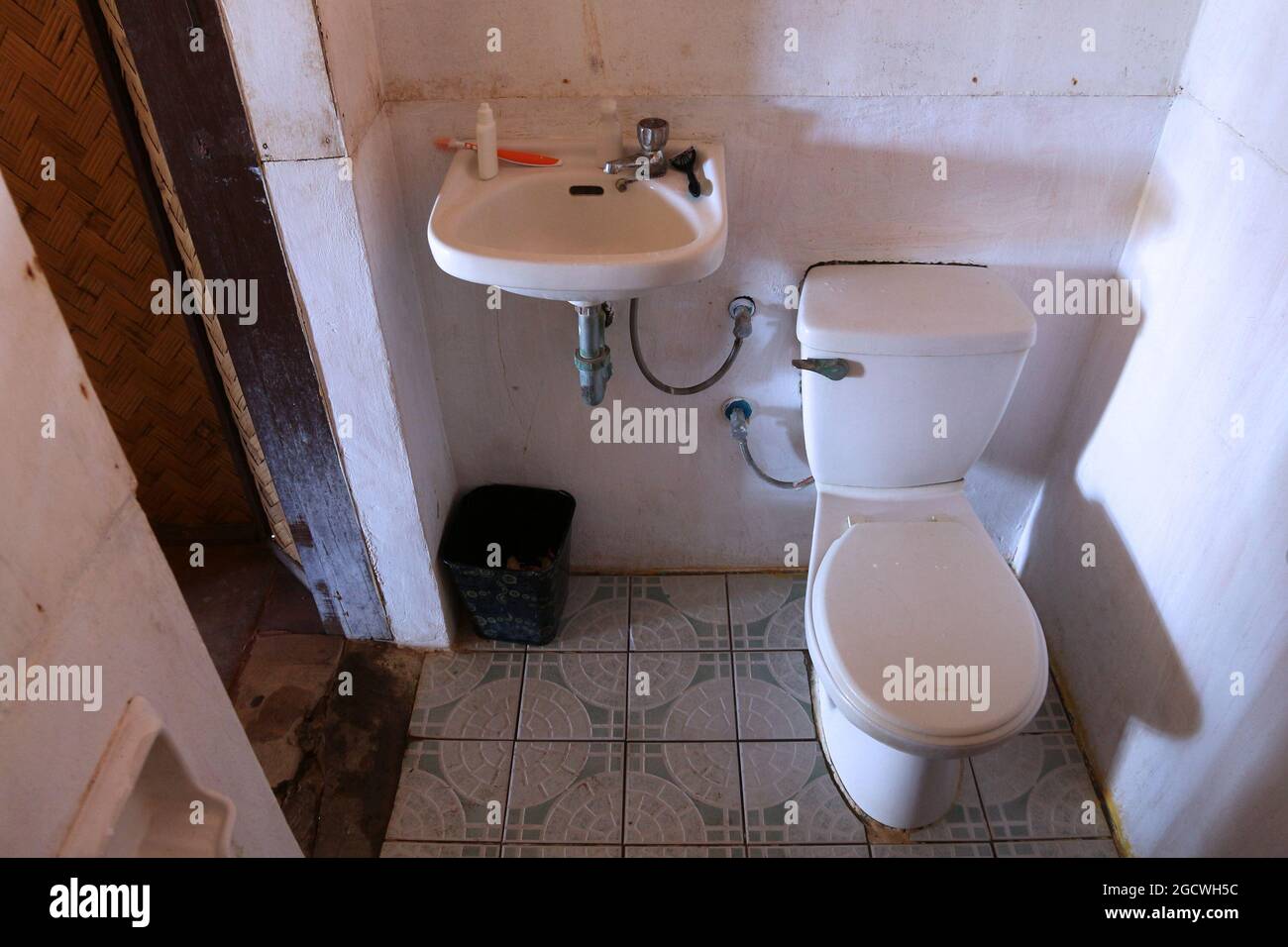 Generic cheap hotel bathroom in Philippines. Dirty low quality WC in