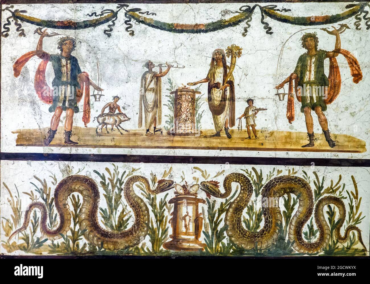 Lares and snakes Two Lares are represented in a typical act of pouring wine from a rhyton in a bucket, on either side of a sacrifice scene, performed by the Genius assisted by attendants and by a double flute player. Below a pair of snakes, symbols of prosperity, lie near an altar with eggs fresco Pompeii 55-79 AD Stock Photo