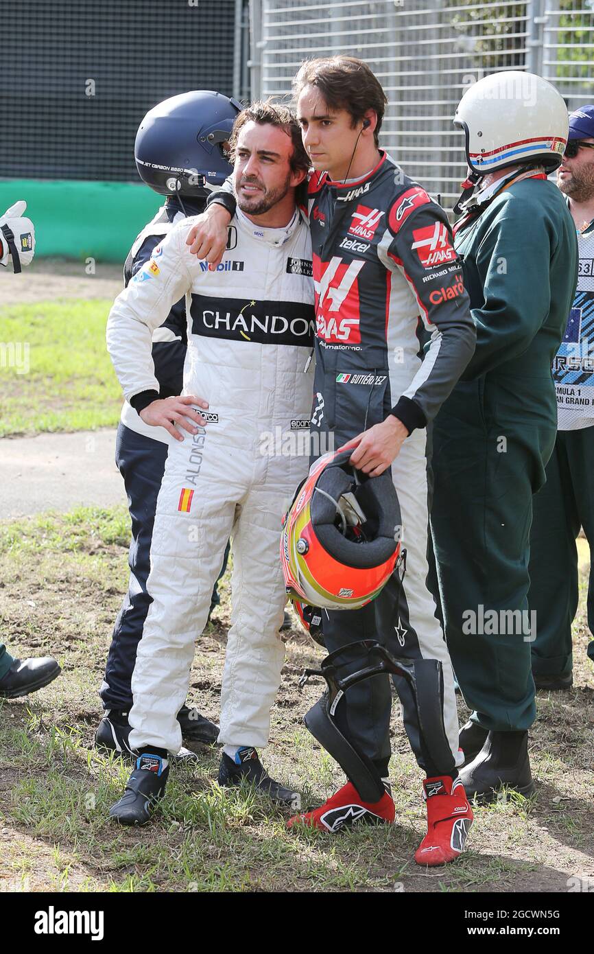 (L to R): Fernando Alonso (ESP) McLaren and Esteban Gutierrez (MEX) Haas F1 Team after their race stopping crash. Australian Grand Prix, Sunday 20th March 2016. Albert Park, Melbourne, Australia. Stock Photo