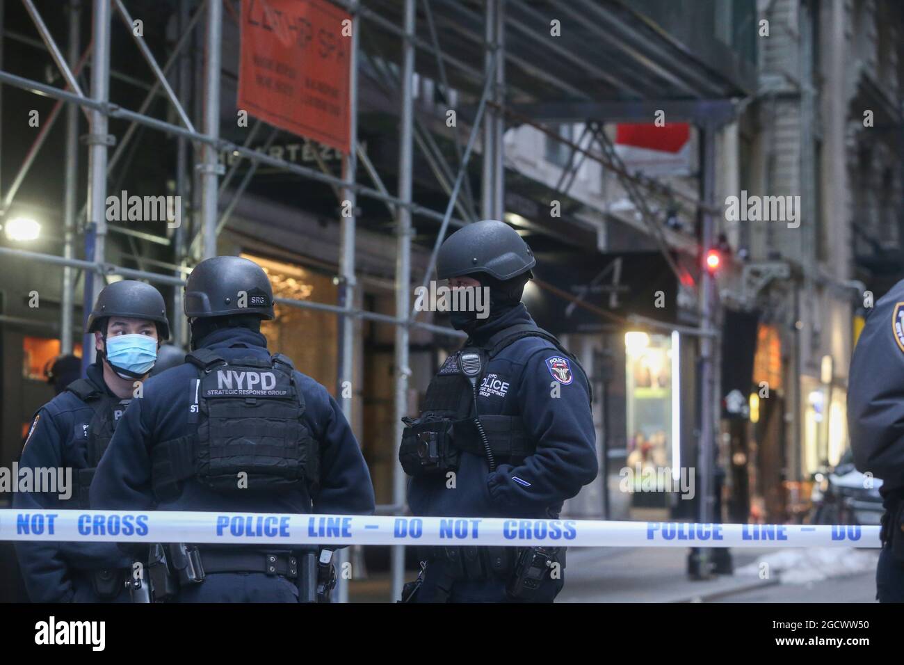 NYPD ESU unit stands guard outside a hotel in downtown Manhattan where a mentally disturbed person had barricaded themselves Stock Photo