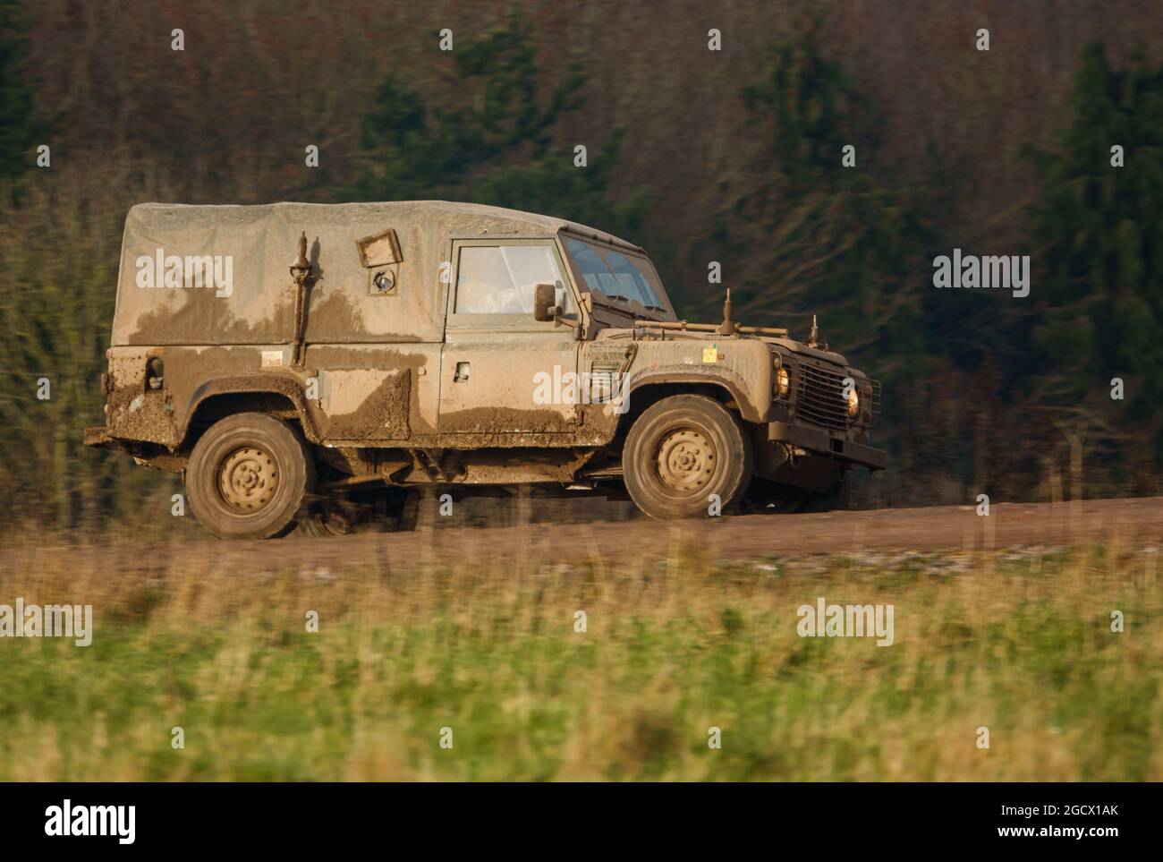 British Army Land Rover Defender light utility vehicle on exercise Salisbury Plain, Wiltshire, UK Stock Photo