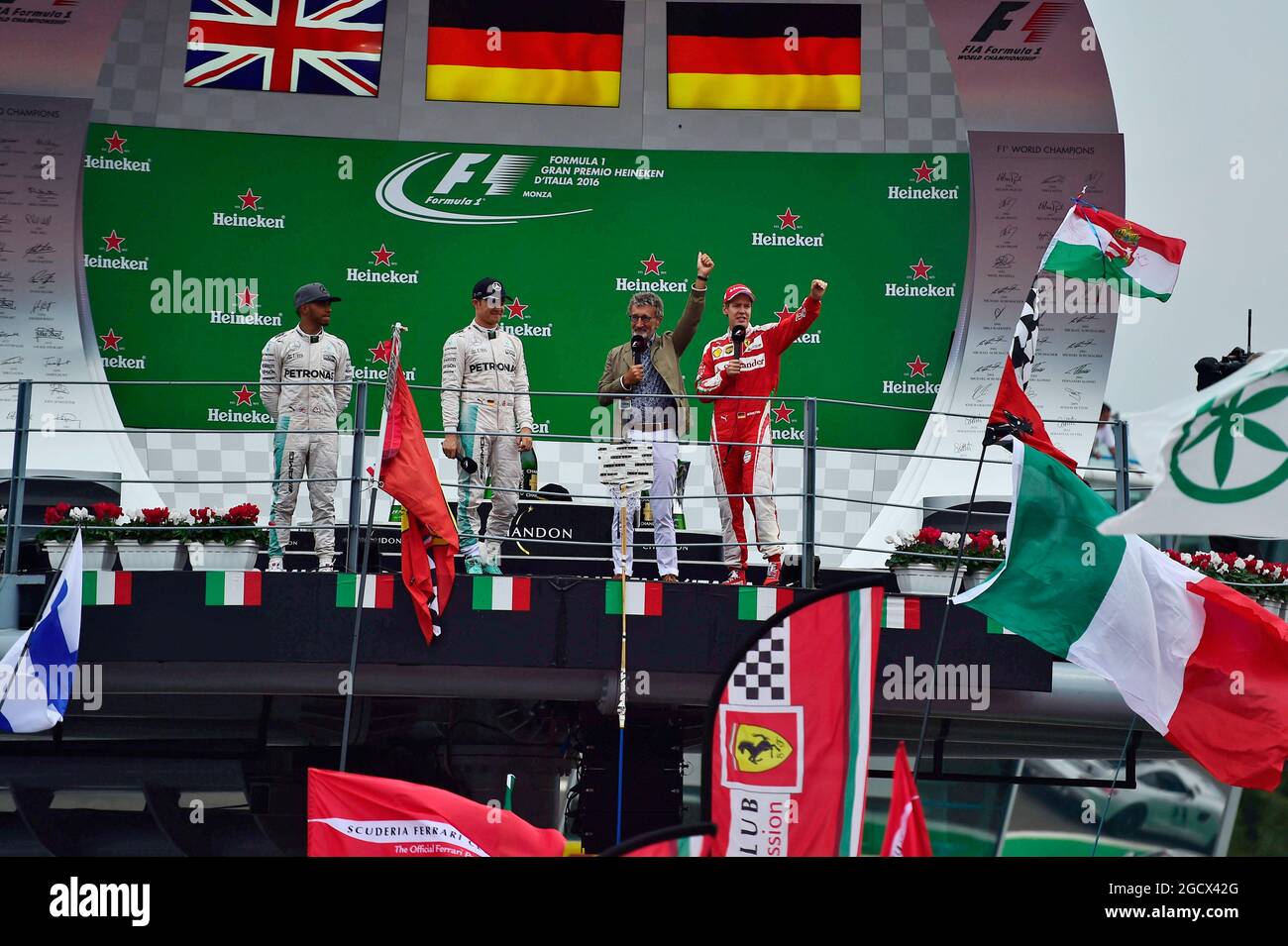 The podium (L to R): Lewis Hamilton (GBR) Mercedes AMG F1, second; Nico Rosberg (GER) Mercedes AMG F1, race winner; Eddie Jordan (IRE); Sebastian Vettel (GER) Ferrari, third. Italian Grand Prix, Sunday 4th September 2016. Monza Italy. Stock Photo
