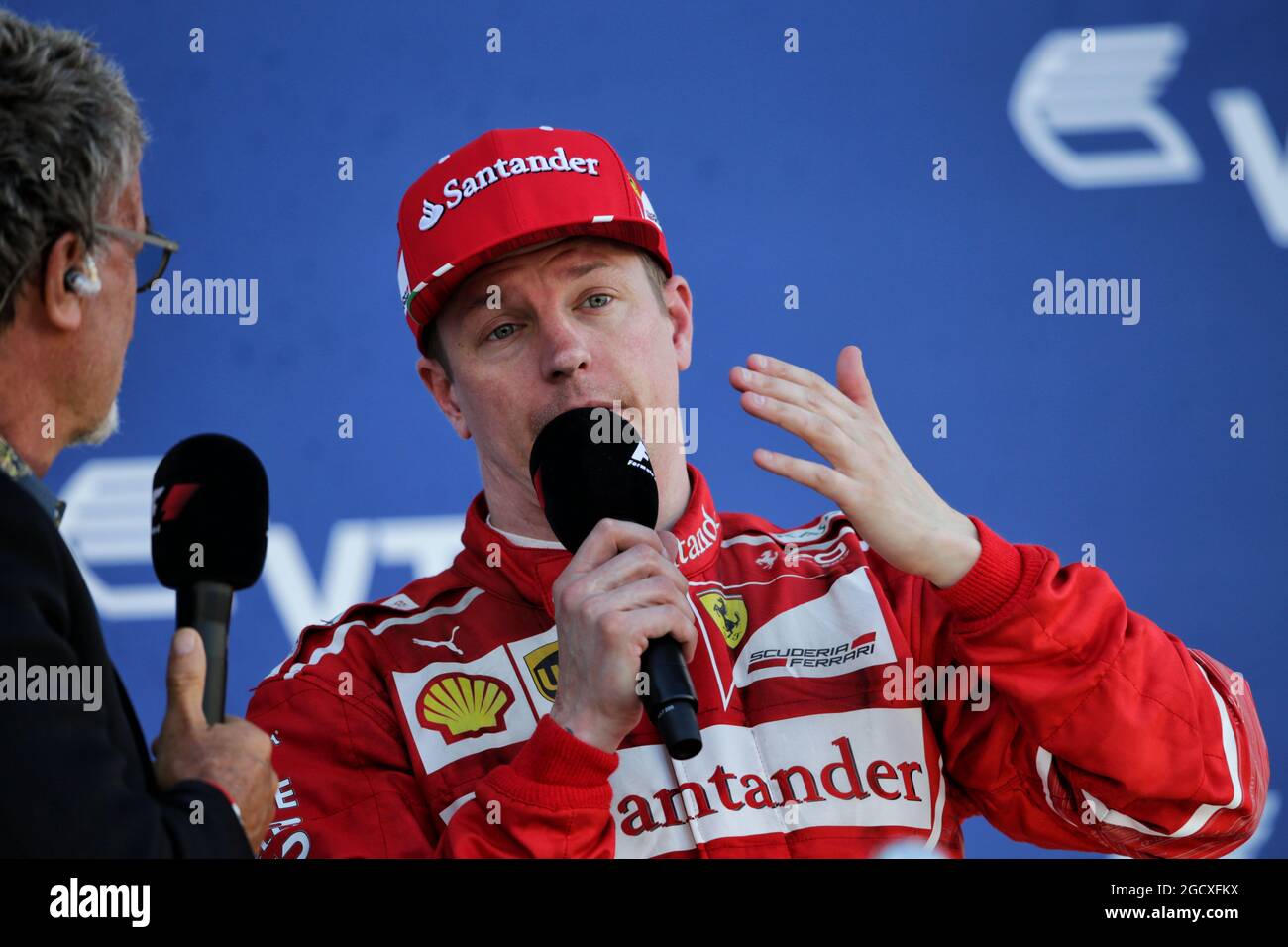 Kimi Raikkonen FIN Ferrari on the podium with Eddie Jordan IRE Russian Grand Prix Sunday