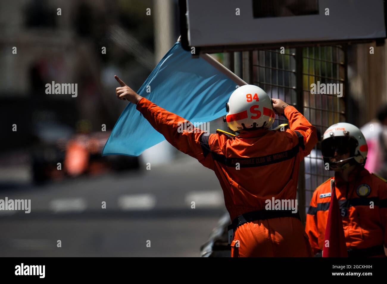 A marshal waves a blue flag. Monaco Grand Prix, Saturday 27th May 2017. Monte Carlo, Monaco. Stock Photo