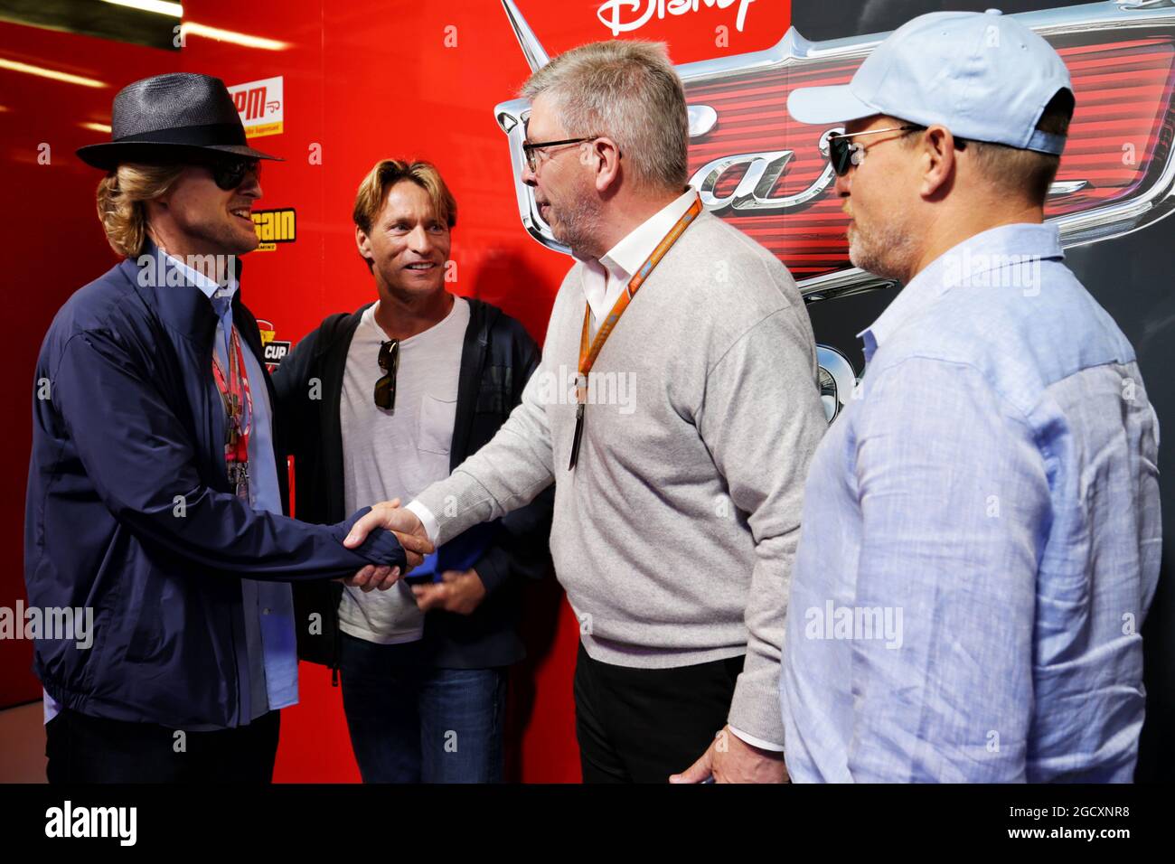 Owen Wilson (USA) Actor (Left), Ross Brawn (GBR) Managing Director, Motor Sports, (Centre), and Woody Harrelson (USA) Actor (Right). British Grand Prix, Sunday 16th July 2017. Silverstone, England. Stock Photo