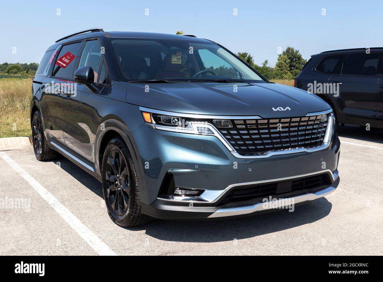 Muncie - Circa August 2021: Kia Carnival display. Kia Motors is ...