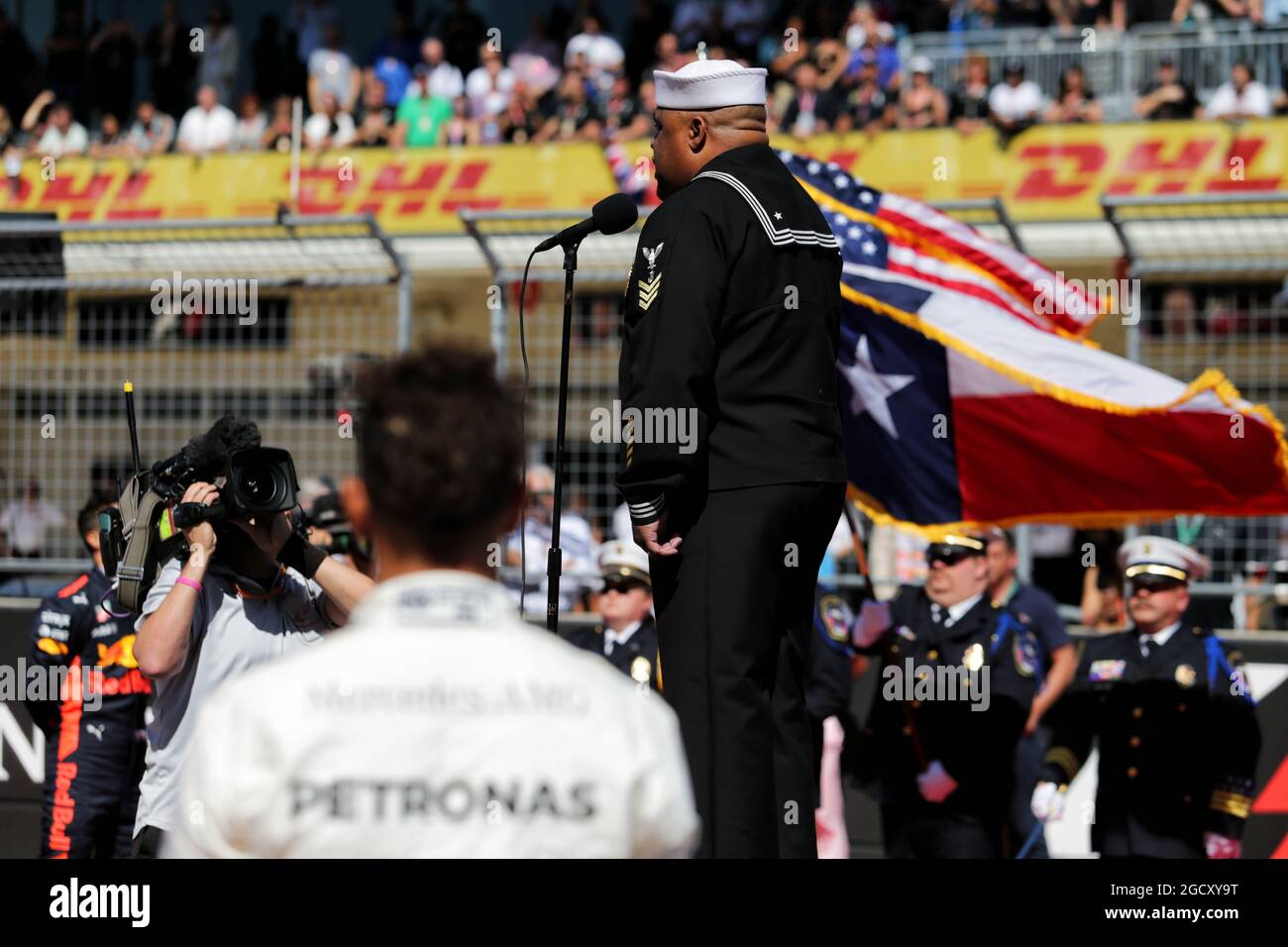 Mercedes amg f1 on grid as grid observes national anthem hires stock