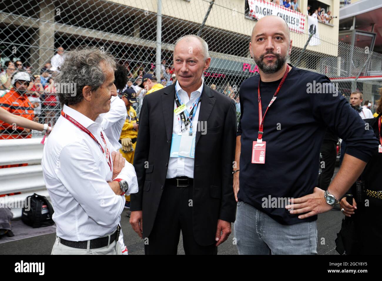 (L to R): Alain Prost (FRA) Renault Sport F1 Team Special Advisor with Thierry Bollore (FRA) Renault Chief Competitive Officer and Cyril Abiteboul (FRA) Renault Sport F1 Managing Director on the grid. Monaco Grand Prix, Sunday 27th May 2018. Monte Carlo, Monaco. Stock Photo