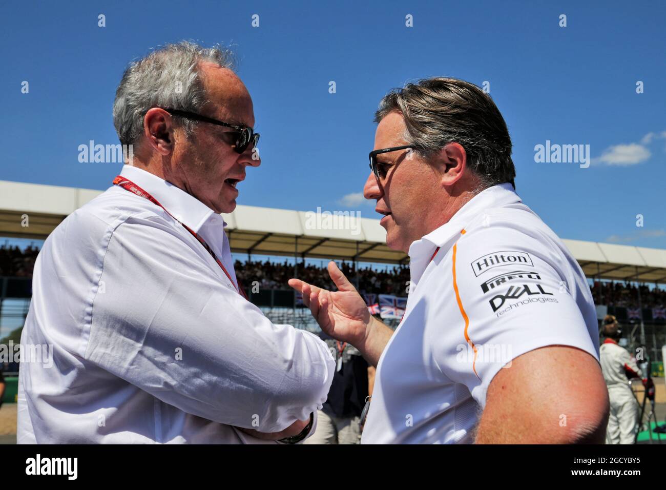 (L to R): Jerome Stoll (FRA) Renault Sport F1 President with Zak Brown (USA) McLaren Executive Director on the grid. British Grand Prix, Sunday 8th July 2018. Silverstone, England. Stock Photo