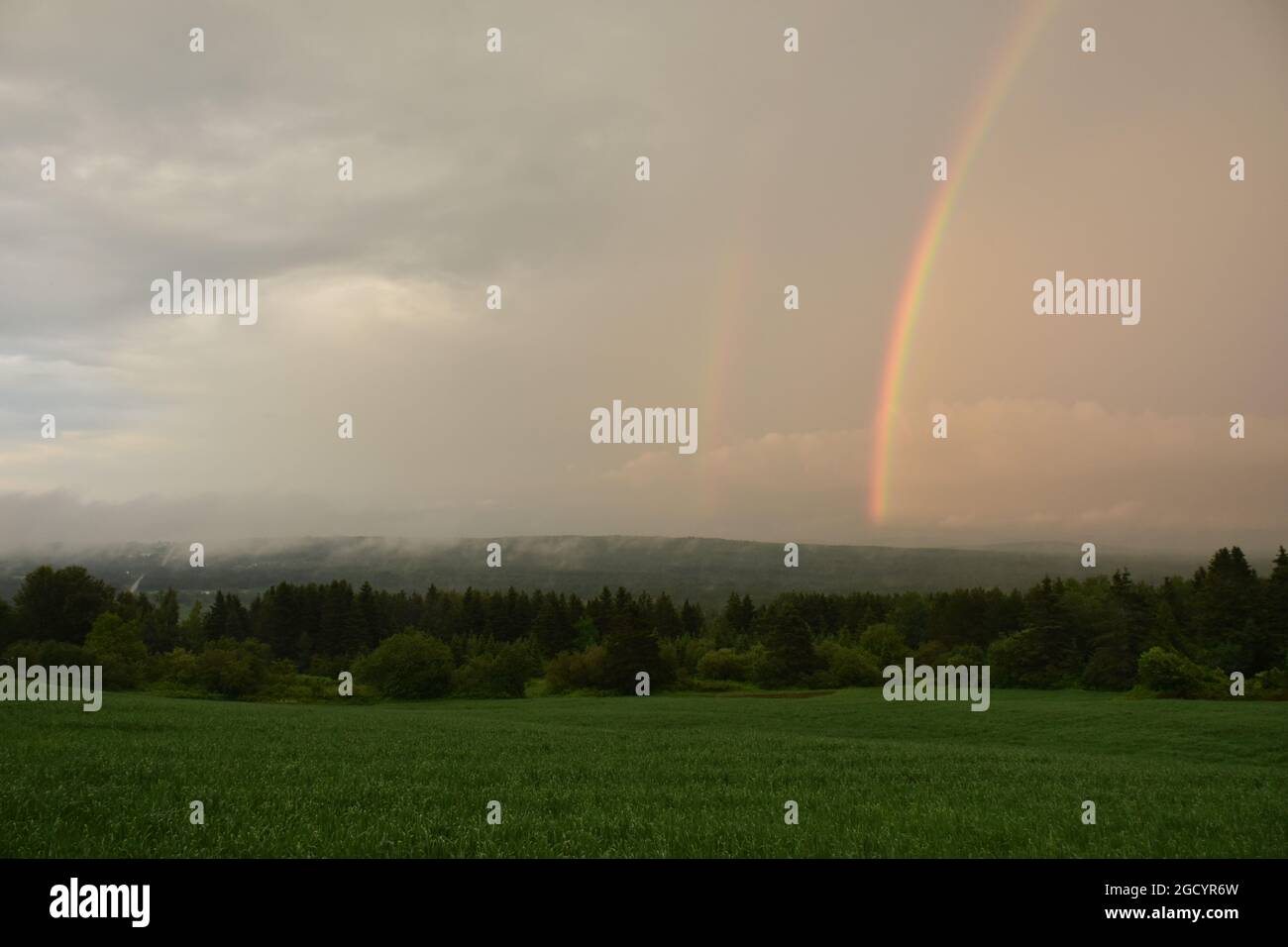A rainbow after the storm Stock Photo - Alamy