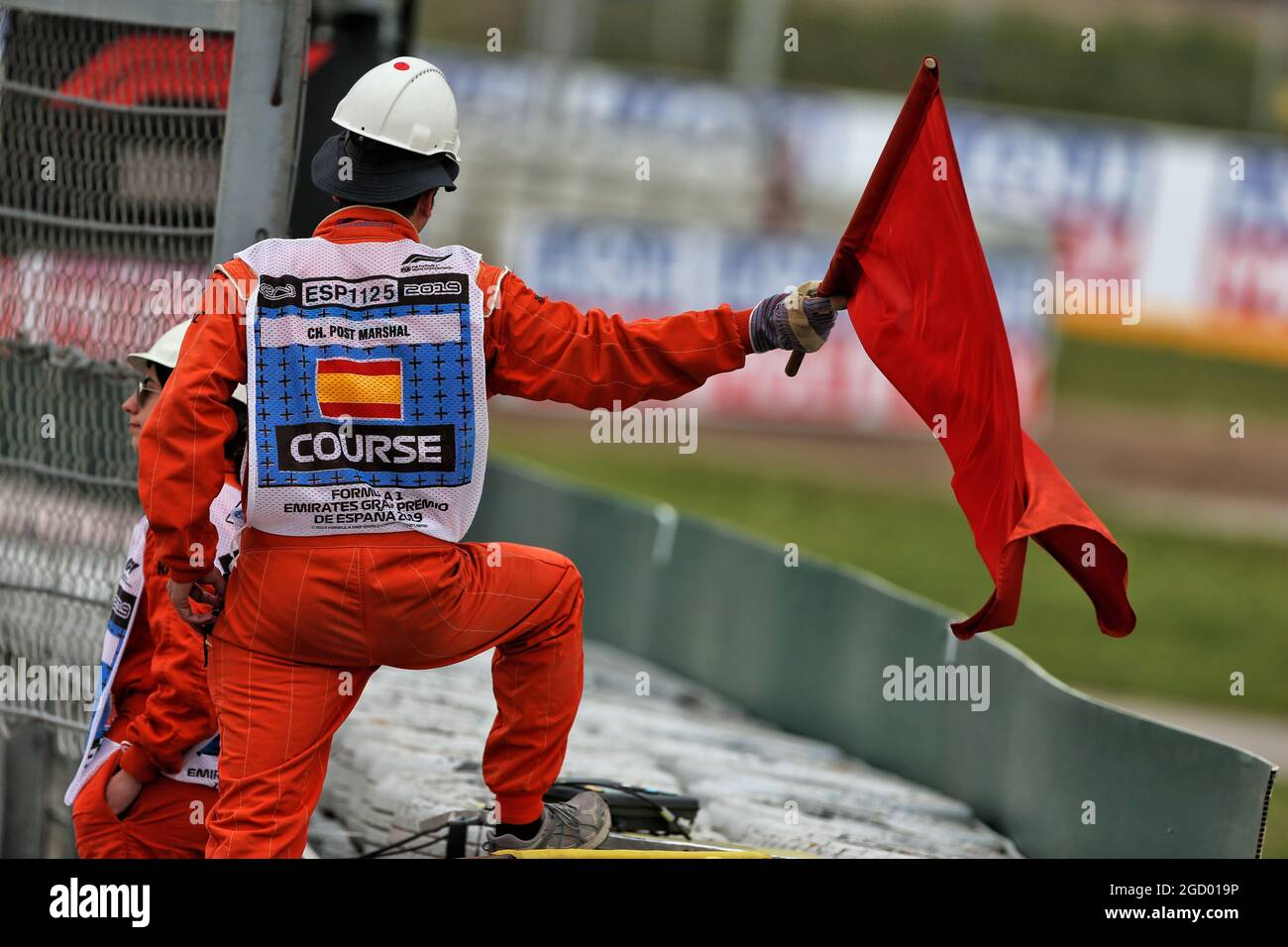 A marshal waves the red flag as the session is stopped. Spanish Grand Prix, Saturday 11th May 2019. Barcelona, Spain. Stock Photo