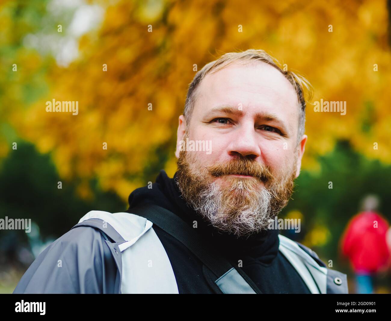 Adult Handsome bearded man outdoors portrait in autumn park. Candid portrait Stock Photo
