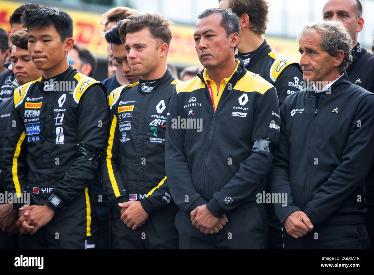 F1, F2, and F3 pay their respects to Anthoine Hubert (L to R): Ye Yifei (CHN) Renault Sport Academy Driver; Max Fewtrell (GBR) Renault Sport Academy Driver; Mia Sharizman (MAL) Renault Sport Academy Director; Alain Prost (FRA) Renault F1 Team Special Advisor. Belgian Grand Prix, Sunday 1st September 2019. Spa-Francorchamps, Belgium. Stock Photo