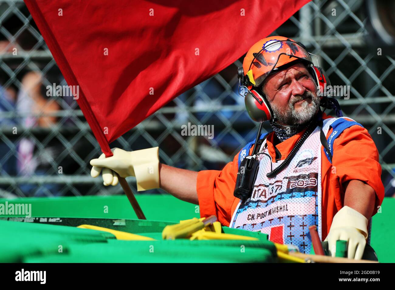 A marshal waves the red flag during qualifying. Italian Grand Prix, Saturday 7th September 2019. Monza Italy. Stock Photo