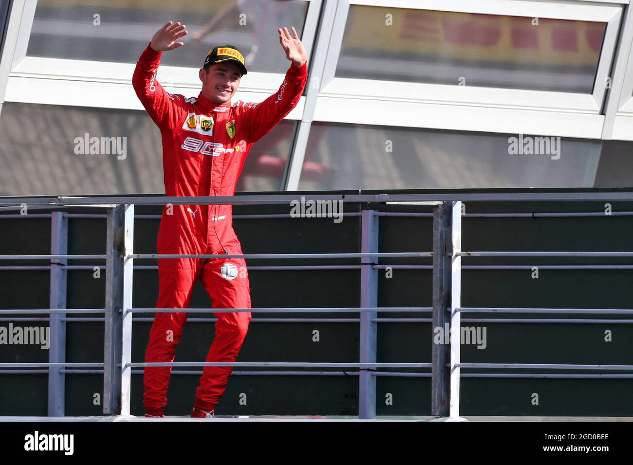 Race winner Charles Leclerc celebrate on the podium with the