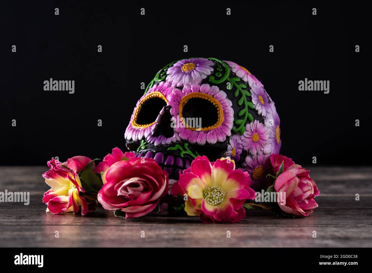 Typical Mexican skull and flowers diadem on black background. Dia de los muertos. Stock Photo