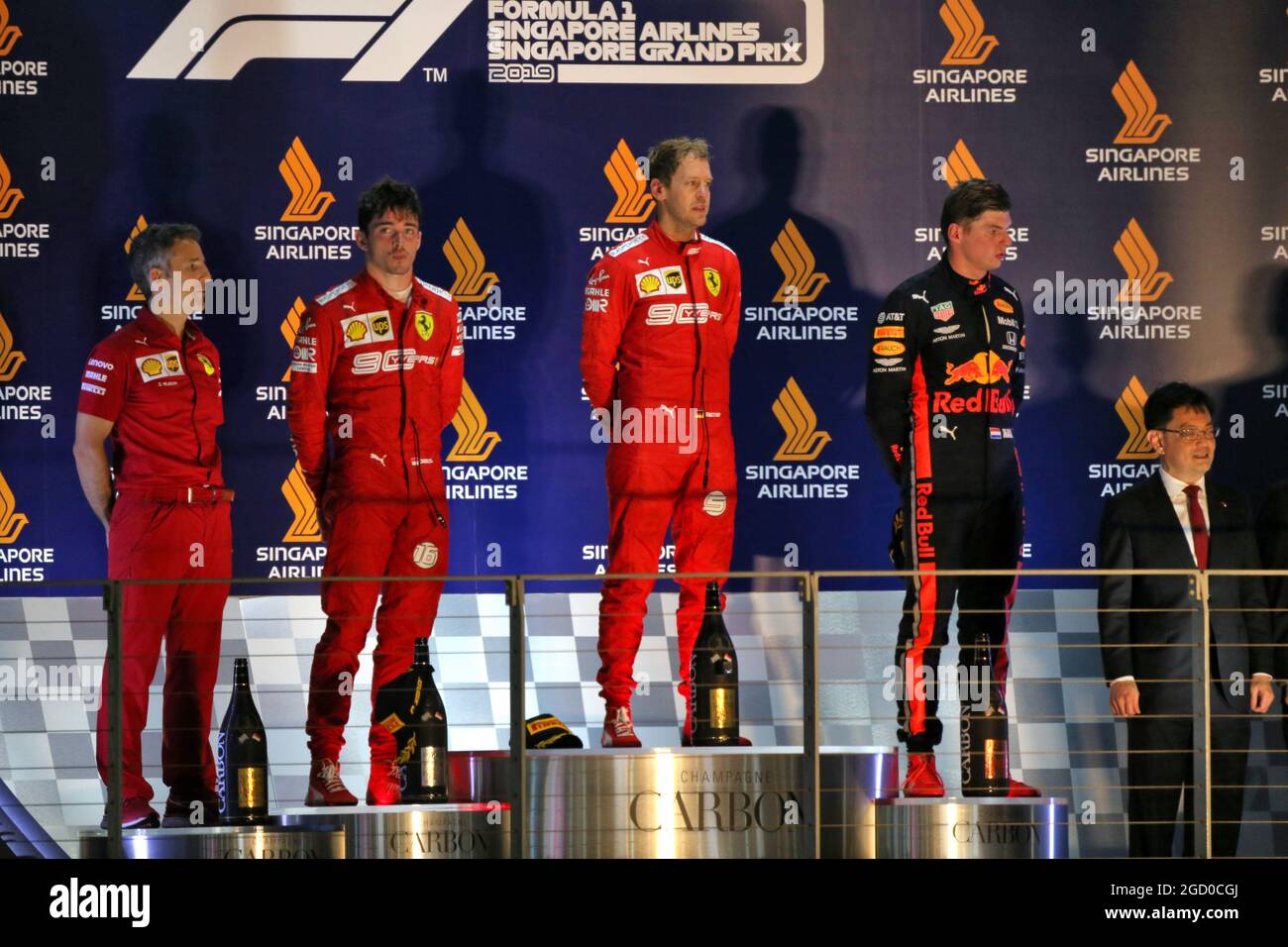 The podium (L to R): Inaki Rueda (ESP) Ferrari Race Strategist; Charles  Leclerc (MON) Ferrari, second; Sebastian Vettel (GER) Ferrari, race winner;  Max Verstappen (NLD) Red Bull Racing, third. Singapore Grand Prix,