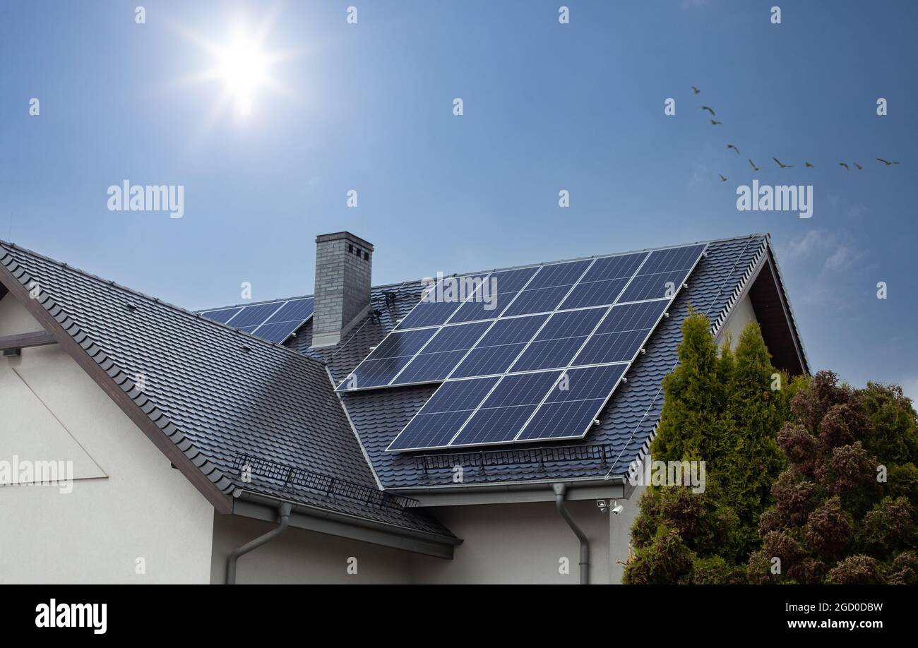 Solar panels on a gable roof. Beautiful, modern house and solar energy