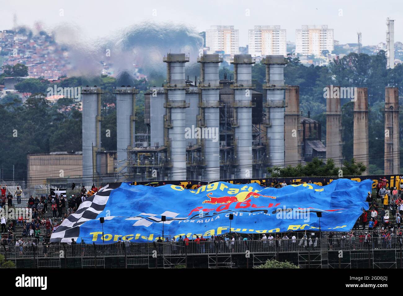 Circuit atmosphere large red bull racing flag fans in grandstand hires