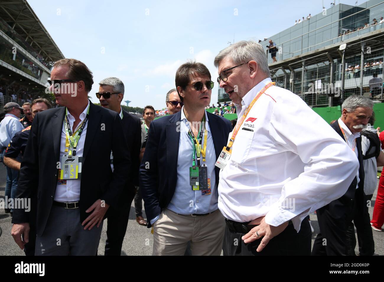 Ross Brawn (GBR) Managing Director, Motor Sports with Arnaud Boetsch (FRA) Rolex Communication and Image Director on the grid. Stock Photo