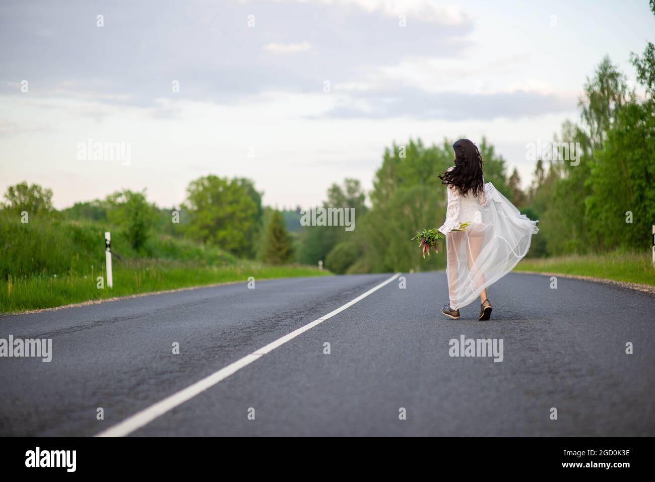 Woman running dress rear view hi-res stock photography and images - Alamy