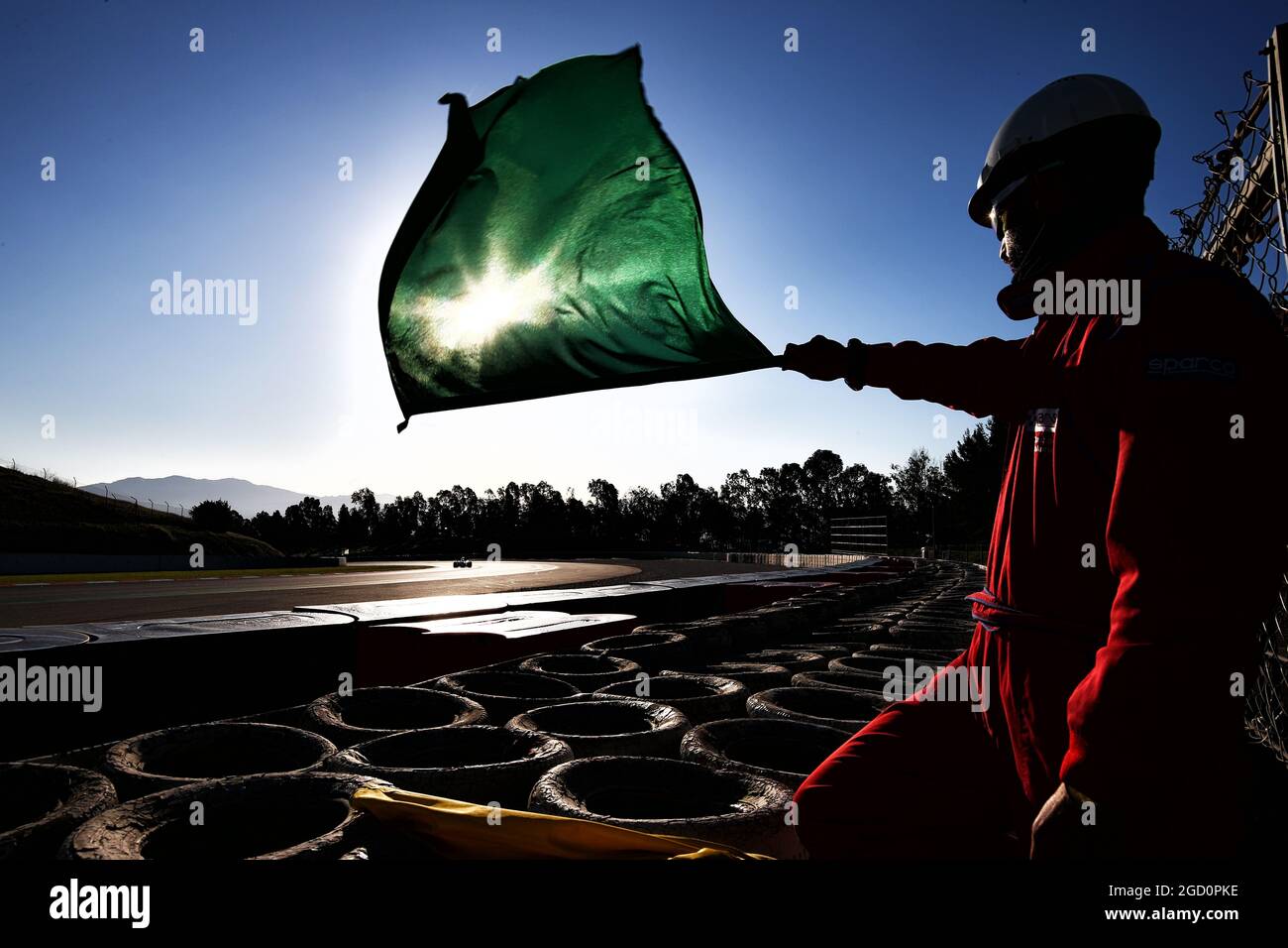 Marshal with a green flag. Formula One Testing, Day 3, Friday 28th February 2020. Barcelona, Spain. Stock Photo