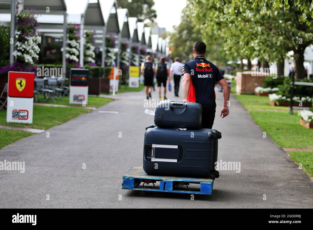 Red bull racing suitcases pulled along paddock hires stock photography