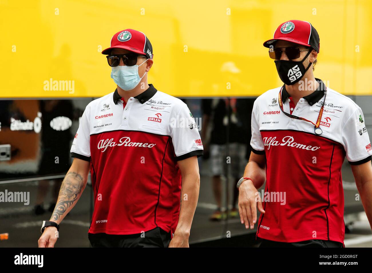 L to R): Kimi Raikkonen (FIN) Alfa Romeo Racing with team mate Antonio  Giovinazzi (ITA) Alfa Romeo Racing. Austrian Grand Prix, Thursday 2nd July  2020. Spielberg, Austria Stock Photo - Alamy