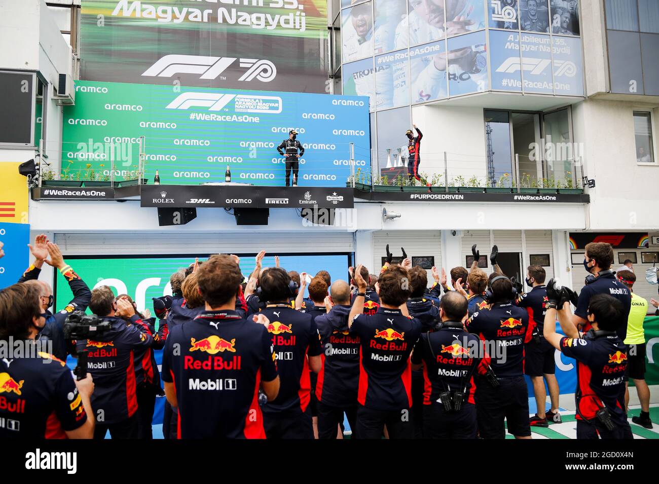 (L to R): Valtteri Bottas (FIN) Mercedes AMG F1 and Max Verstappen (NLD) Red Bull Racing (Right), who celebrates his second position on the podium in front of his team. Hungarian Grand Prix, Sunday 19th July 2020. Budapest, Hungary. FIA Pool Image for Editorial Use Only Stock Photo