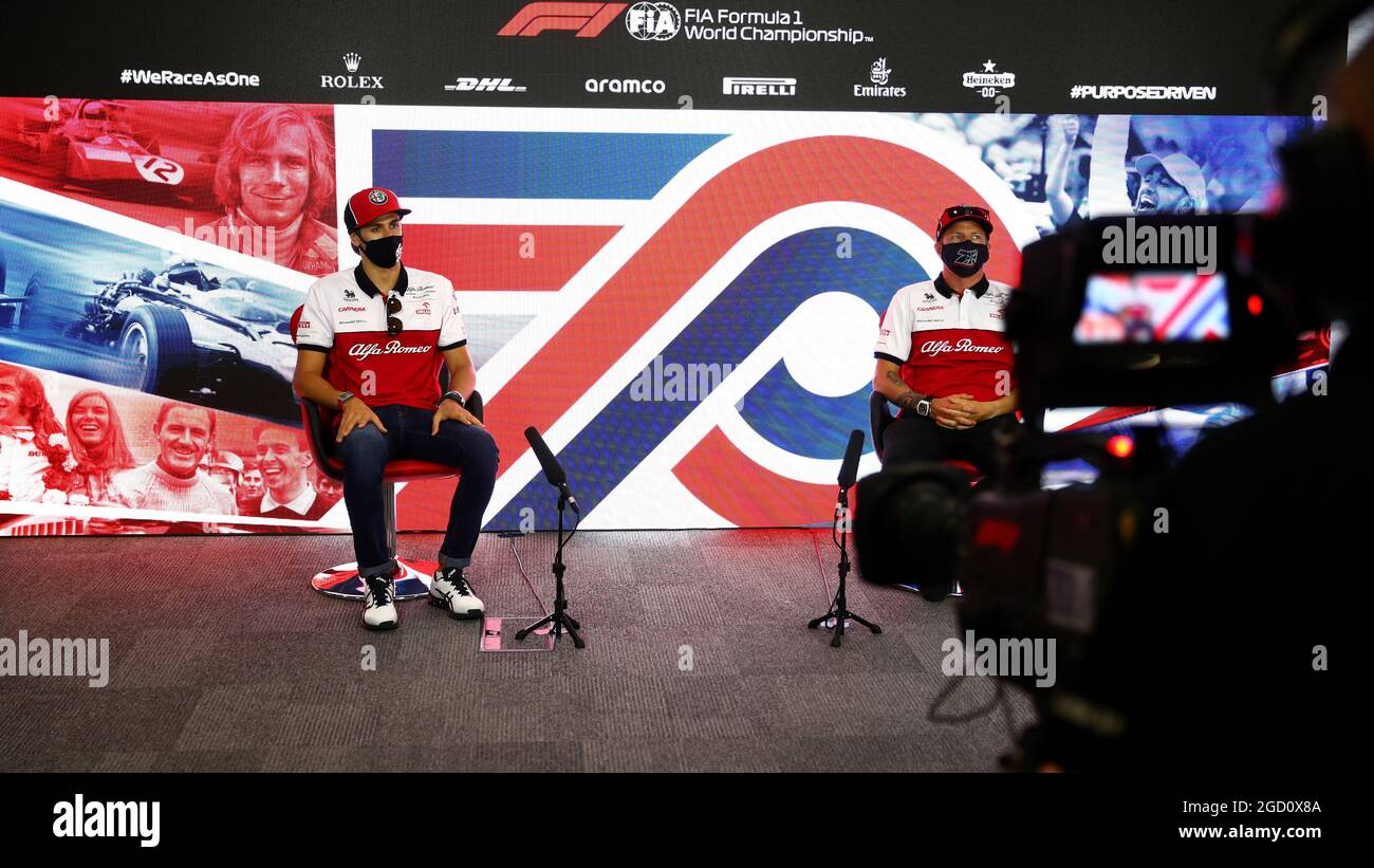(L to R): Antonio Giovinazzi (ITA) Alfa Romeo Racing and team mate Kimi ...