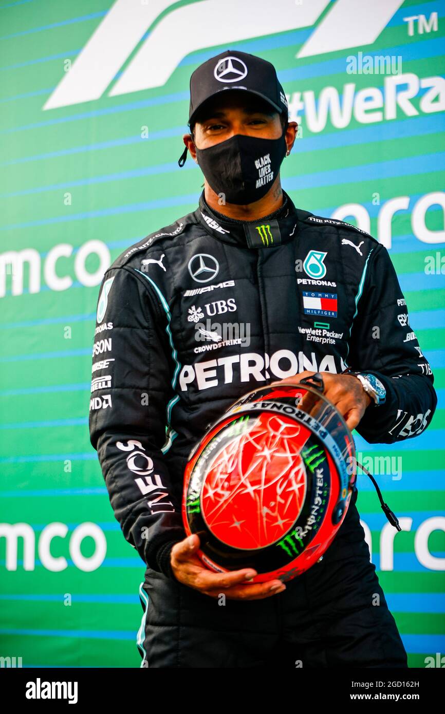 Race winner Lewis Hamilton (GBR) Mercedes AMG F1 with the helmet of Michael  Schumacher (GER) by Mick Schumacher (GER) in parc ferme after equalling the  record for the number of F1 victories.