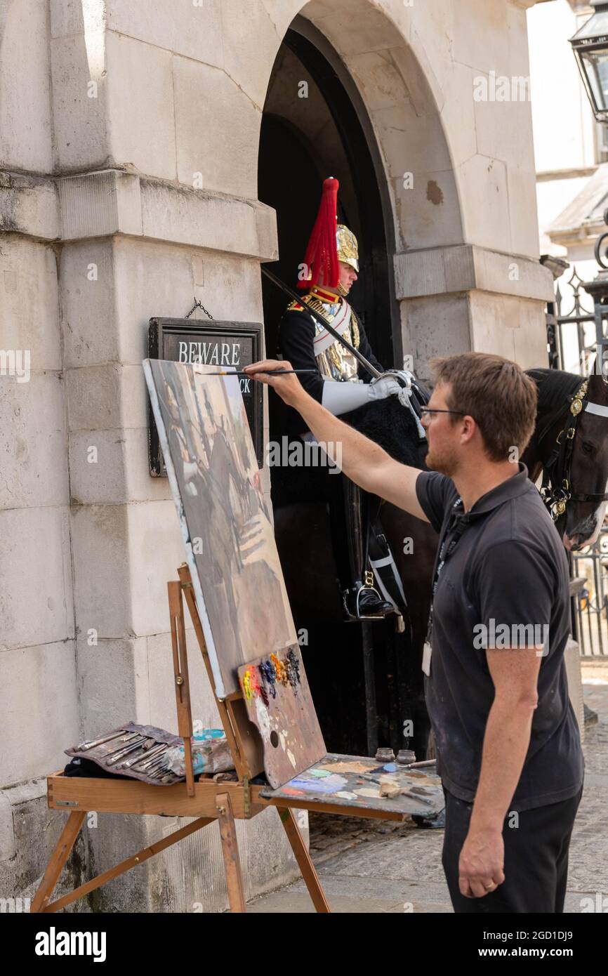 London, UK. 10th Aug, 2021. Rob Pointon, artist in residence at the Household Cavalry, painting ...
