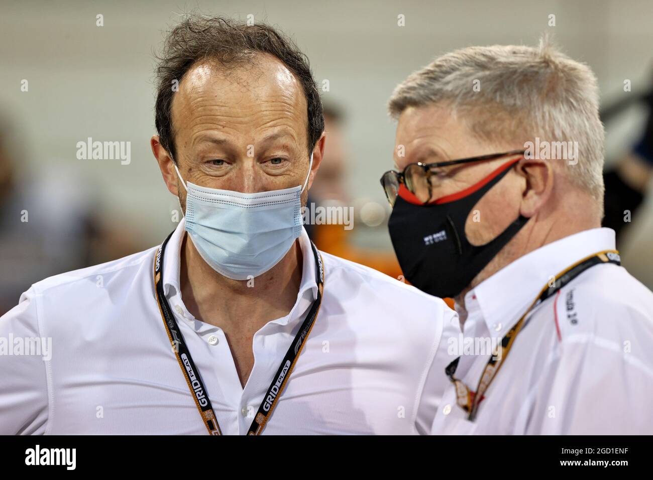 (L to R): Peter Bayer, FIA Secretary General for Motor Sport with Ross Brawn (GBR) Managing Director, Motor Sports on the grid. Bahrain Grand Prix, Sunday 28th March 2021. Sakhir, Bahrain. Stock Photo