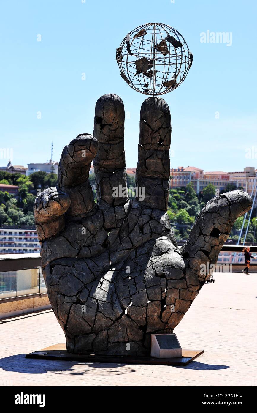 Scenic Monaco - hand balancing a globe statue. Monaco Grand Prix, Wednesday 19th May 2021. Monte Carlo, Monaco. Stock Photo