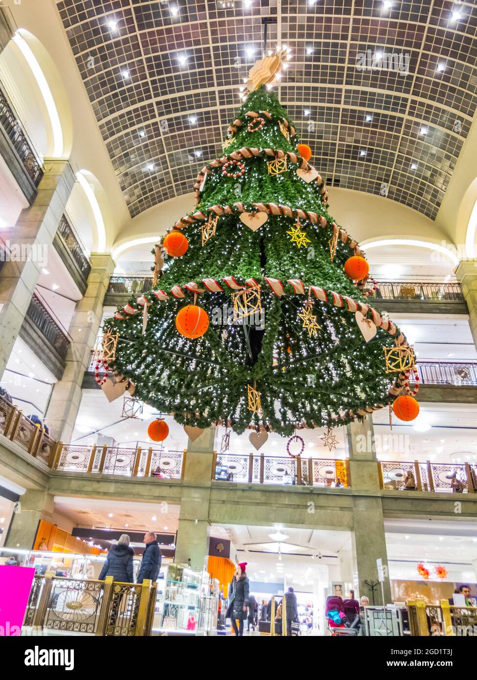Low angle of a big beautifully decorated Christmas tree hanging from