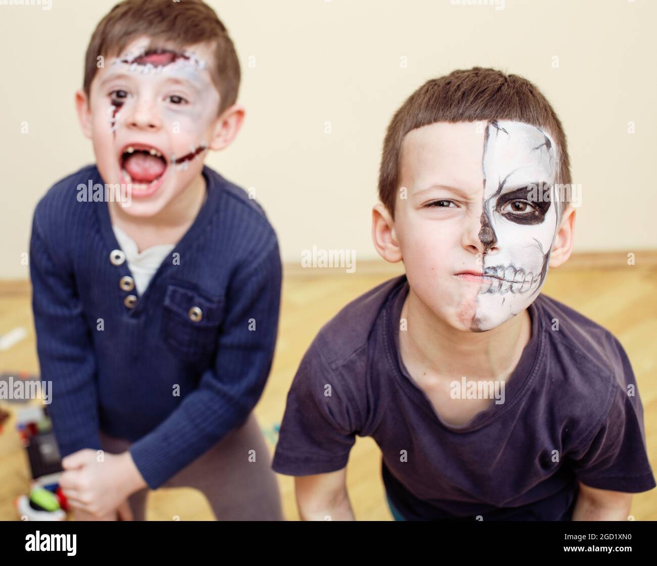 zombie apocalypse kids concept. Birthday party celebration facepaint on children dead bride, scar face, skeleton together having fun Stock Photo