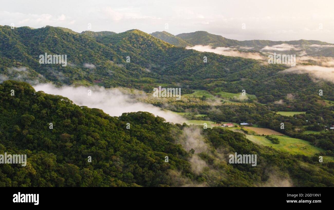Landscape view of a mountain valley with low clouds Stock Photo - Alamy