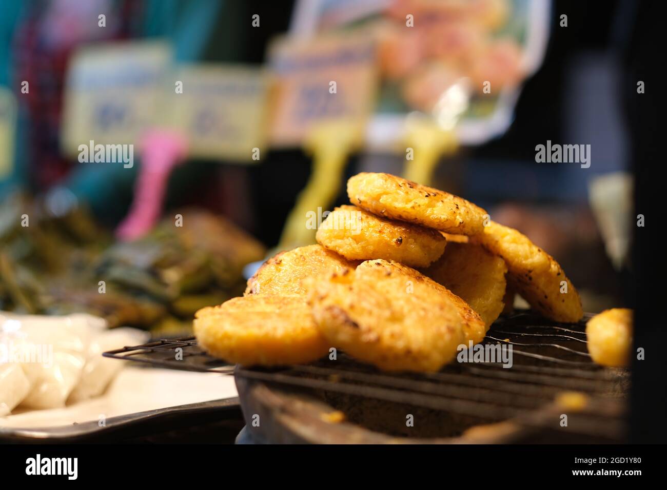 Night Market In Thailand A Pile Of Ready to eat Grilled Rice Cakes On night-market-in-thailand-a-pile-of-ready-to-eat-grilled-rice-cakes-on
