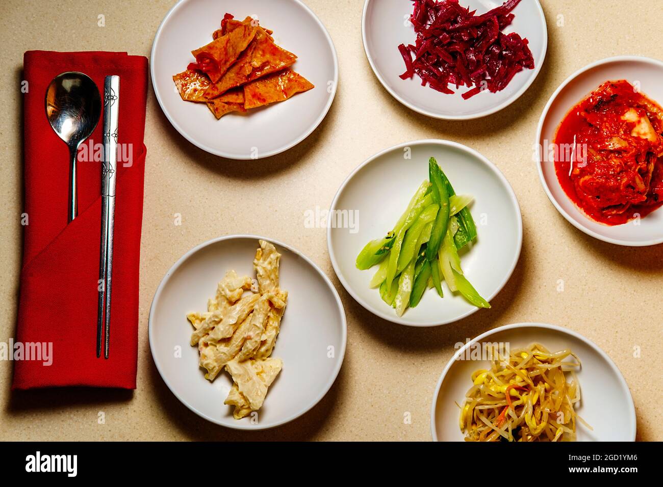 Korean dinner banchan side dishes including kimchi and soybeans Stock