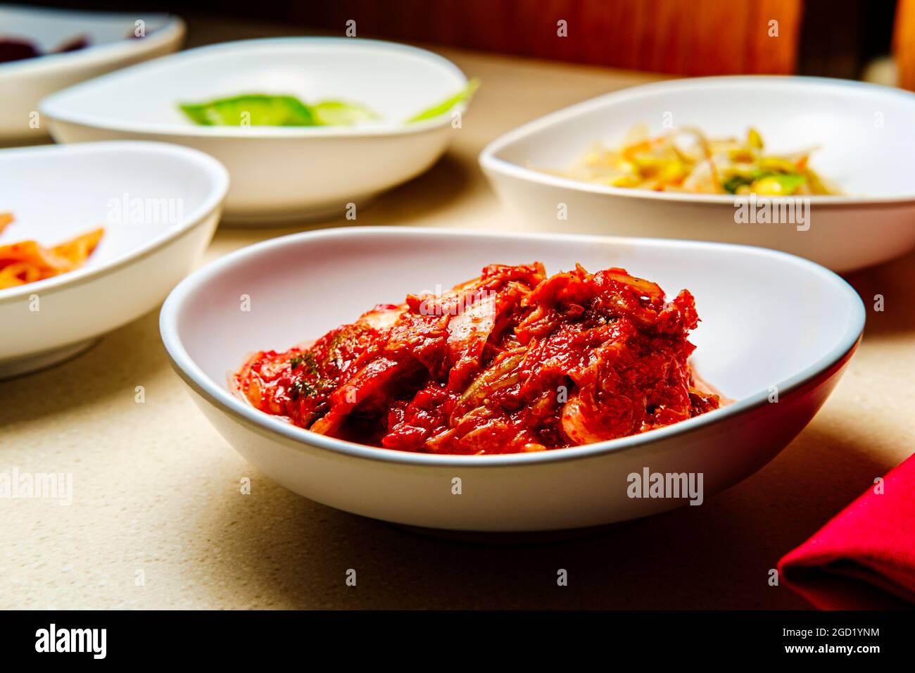 Korean dinner banchan side dishes including kimchi and soybeans Stock